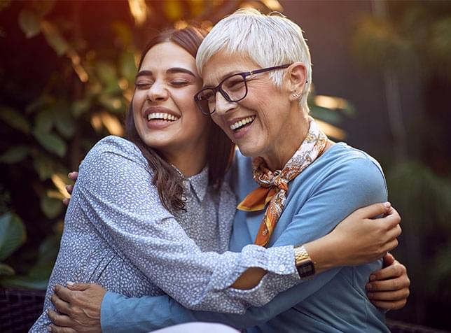 Young person and elderly person embracing - link to The General Partners Life Insurance page